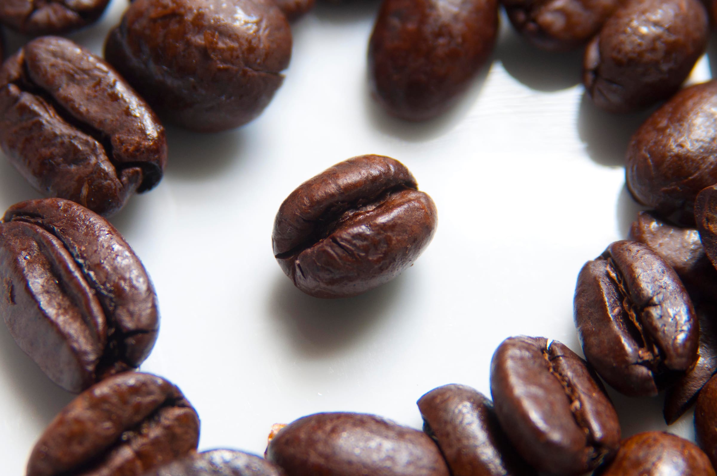 Macro photograph of roasted coffee beans.
